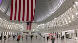 Giant American flags hanging within the Oculus, World Trade Center Transportation Hub, to commemorate 9/11