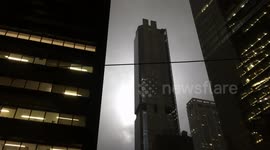 World Trade Center skyscrapers lit up by the double beams of light that evoke the fallen Twin Towers in commemoration of 9/11 in New York City.