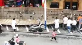 Three injured after huge billboard falls off shops in southern China