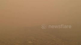 Drone footage of Californian city shrouded in darkness due to smoke clouds from wildfires