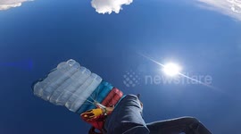 Terrifying moment a paraglider sets fire to his 'chute - at 7,000ft