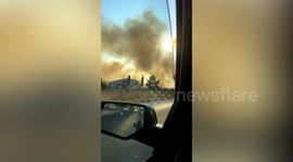 California Fires Rage On Roadside