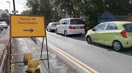 Long queues form at UK COVID-19 testing sites as infections rise