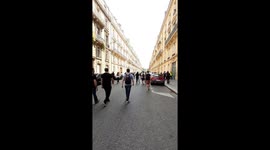 Feminists write messages on the wall as a yellow vest protest march through Paris