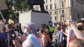 Police guard Winston Churchill statue as Trans Pride marchers arrive at Parliament Square