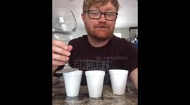 Funny magician from LA shows a trick with cups and water