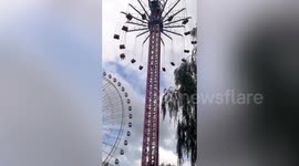 Tourists left hanging in mid air on theme park ride after winds halt spinning chairs