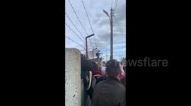 Peaceful protesters in Minsk climb through barbed wire and over walls to get away from riot police