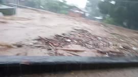 Raging River Washes Away Trees After Heavy Rain In The Philippines