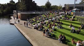 Londoners bask in the hot sun in Kings Cross as heatwave hits the UK