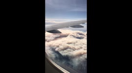 California plane passenger captures blanket of wildfire smoke from '30,000 feet'