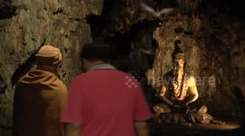 Buddhists worship in cave full of bats in Thailand