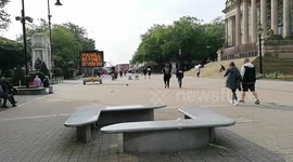 Sign in Bolton Warns Shoppers of Covid