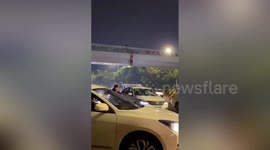 Van catches 'drunk' man falling from footbridge in China