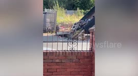 Huge pile of waste in the middle of a residential street from fly tipping