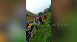 Landslide blocks road after heavy rain in the Philippines
