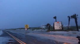 Hurricane Sally surges tide onto coastal road in Pensacola Beach, Florida