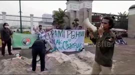 Students Performing Self-Burial Action in Front of the DPR RI Building, Central Jakarta