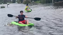 Florida family has fun during Hurricane Sally kayaking in front yard of flooded streets