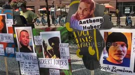 Signs show fatalities linked to alleged police violence and incidents involving far right supporters