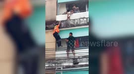 Heart-stopping moment neighbours rescue toddler from 40-foot-high balcony ledge