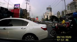 Show-off motorcycle rider crashes while pulling wheelie at junction