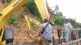 Excavators clear rocks after Typhoon Noul causes landslide in southern Thailand