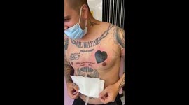 Moment UK man proposes to girlfriend WITH TATTOO