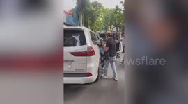 Furious wife catches 'husband and mistress driving to hotel'