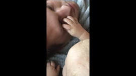 Baby Tries to Wake Up Dad in Funny Way