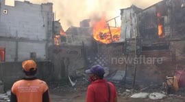 Firefighters battle fire in Jakarta, Indonesia