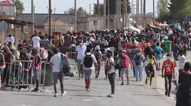 Thousands of migrants in Lesbos queue to enter new camp after devastating fire