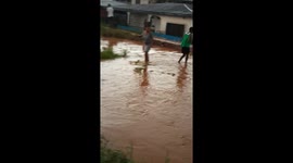 Eroded road destroying buildings and crops