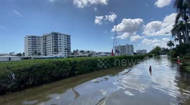 Coastal waters flood residential areas during exceptional high tide in southern Florida
