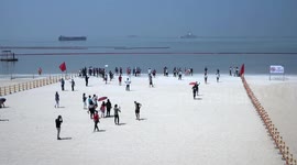 New synthetic 'white sand beach’ draws crowds in Philippines