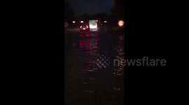 Vehicles drive through flooded streets in Balaruc-le-Vieux, France