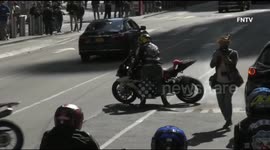 New York climate protest interrupted by motorcyclists burning out their tyres