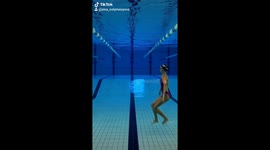 Artistic swimmer walks on Invisible stairs