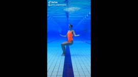 Artistic swimmer can dance upside down underwater