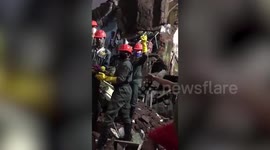 10 killed, many feared trapped as building collapses in western India