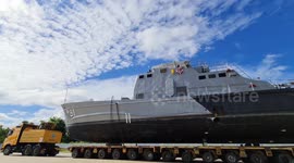 Decommissioned warship causes traffic jams while being transported to resting place in Thailand