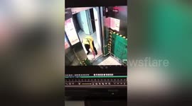 Chinese delivery man breaks lift doors after using cardboard box to prevent them from closing