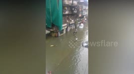 Vehicles submerge in water after heavy rains inundate streets in Mumbai