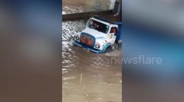 Flooded streets and vehicles submerged as Mumbai hit by heavy rainfall