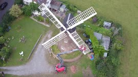 Woman completes ultimate DIY renovation project of one of Britain's last fully working windmills after using cherry picker to paint the sails by hand