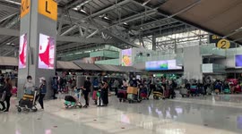 Stranded tourists rush to leave Thailand after being threatened with arrest for overstaying visa