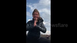 Girl doing the splits between horses as Jean-Claude van Damme