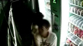 Chinese man dances while on surveillance camera after stealing products from vending machine