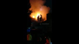 Firefighters battle house fire in Santa Ana, California