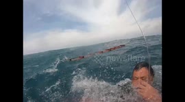 Rescuers save man floating at sea for 10 hours after boat sinks in China